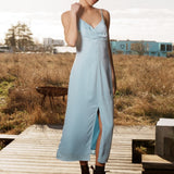 Maxi dress in baby blue with thin straps and an elastic gathering at the chest. TrentonMD print dress has a slit in the front and an invisible zipper at the back.