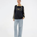Football jersey made in collaboration with the Danish football team Brøndby Women. The 1971 Polo in navy with yellow details features a loose fit, with a placket closure and collar, as well as long sleeves that have ribbed cuffs. The polo features Brøndby Women and Modström logos on the chest.