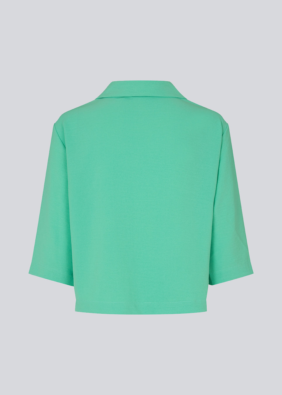 Shirt in green in a relaxed silhouette and 3/4 length sleeves. AaliyahMD shirt has a resort collar, dropped shoulders and button closure in front.