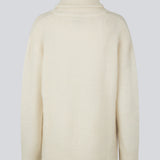 Oversized knitted jumper in white in wool and llama wool mix. AdrianMD t-neck has a relaxed fit with dropped shoulder, rib-knitted rollneck and trimmings. The model is 177 cm and wears a size S/36.