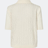 Short-sleeve polo in a sheer knit pattern. The AgnesMD SS Polo features classic details such as a collar, buttons, and ribbed edges. A modern and feminine polo that combines lightness with timeless design.