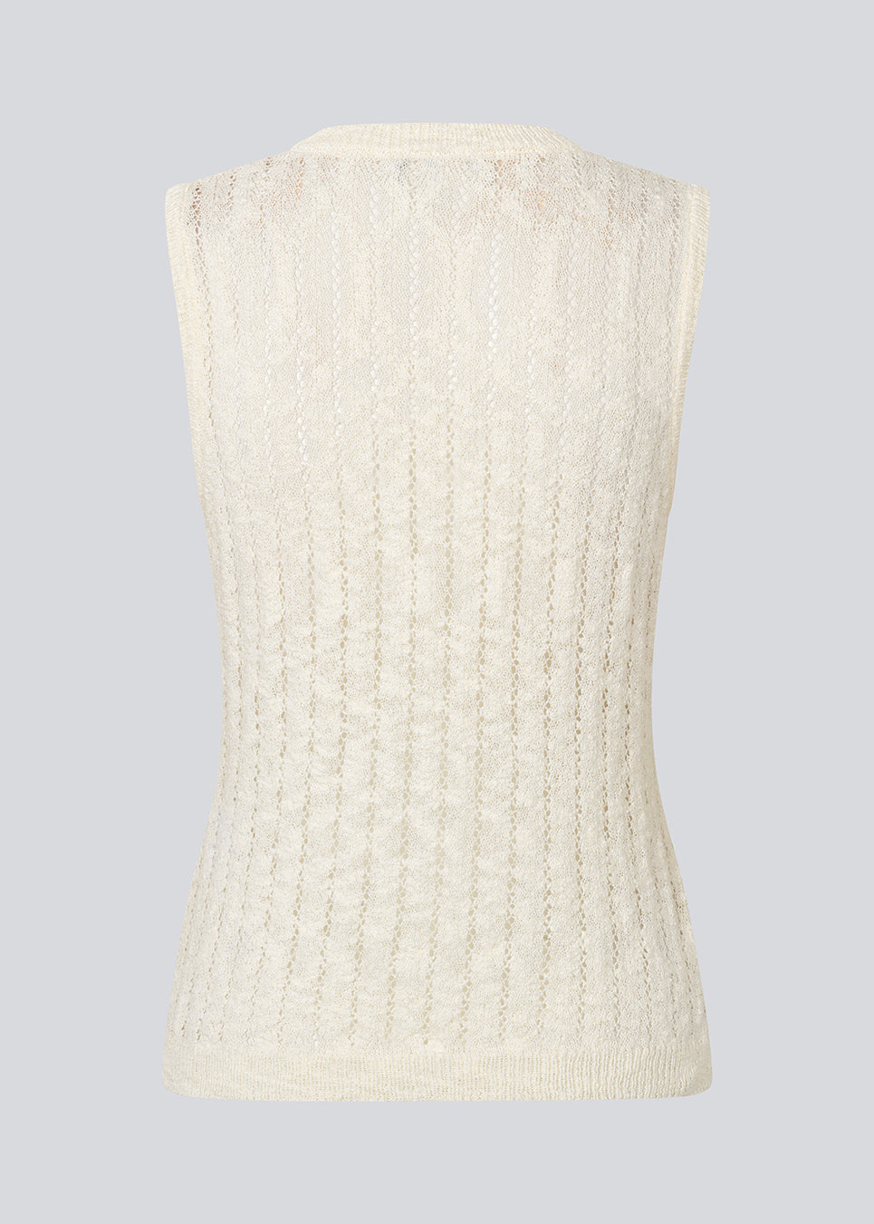 Sleeveless top in a sheer knit pattern. The AgnesMD Top features a round neckline and is perfect for layering. A modern and lightweight top that combines elegance with versatility.