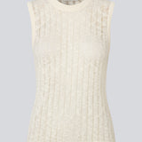 Sleeveless top in a sheer knit pattern. The AgnesMD Top features a round neckline and is perfect for layering. A modern and lightweight top that combines elegance with versatility.