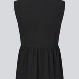 Feminine vest top with a gathered, loose hem. The AgneteMD Vest is sleeveless with a V-neckline and a simple button closure. Can be styled alone or layered for a modern and versatile look.