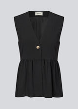 Feminine vest top with a gathered, loose hem. The AgneteMD Vest is sleeveless with a V-neckline and a simple button closure. Can be styled alone or layered for a modern and versatile look.