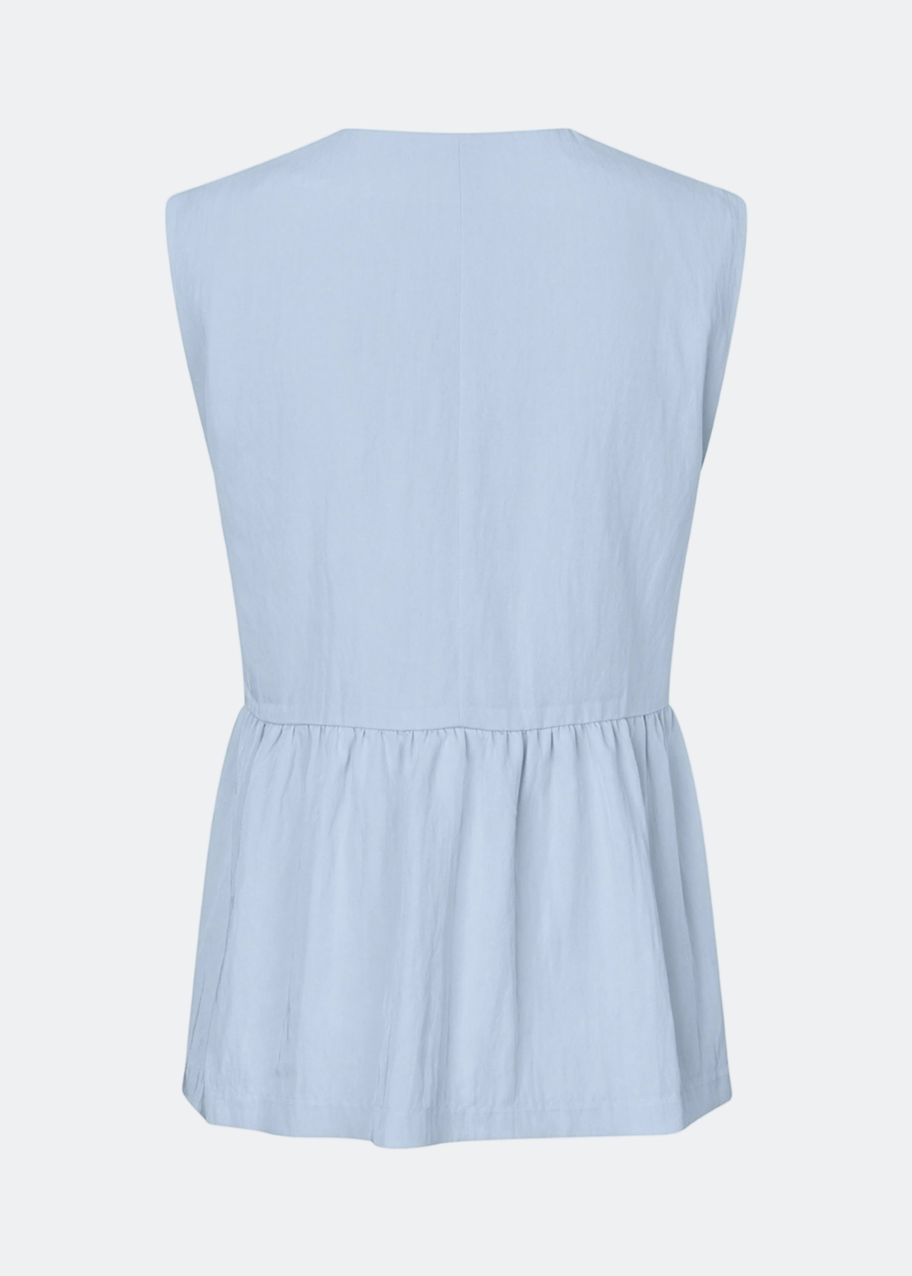 Feminine vest top with a gathered, loose hem. The AgneteMD Vest is sleeveless with a V-neckline and a simple button closure. Can be styled alone or layered for a modern and versatile look.