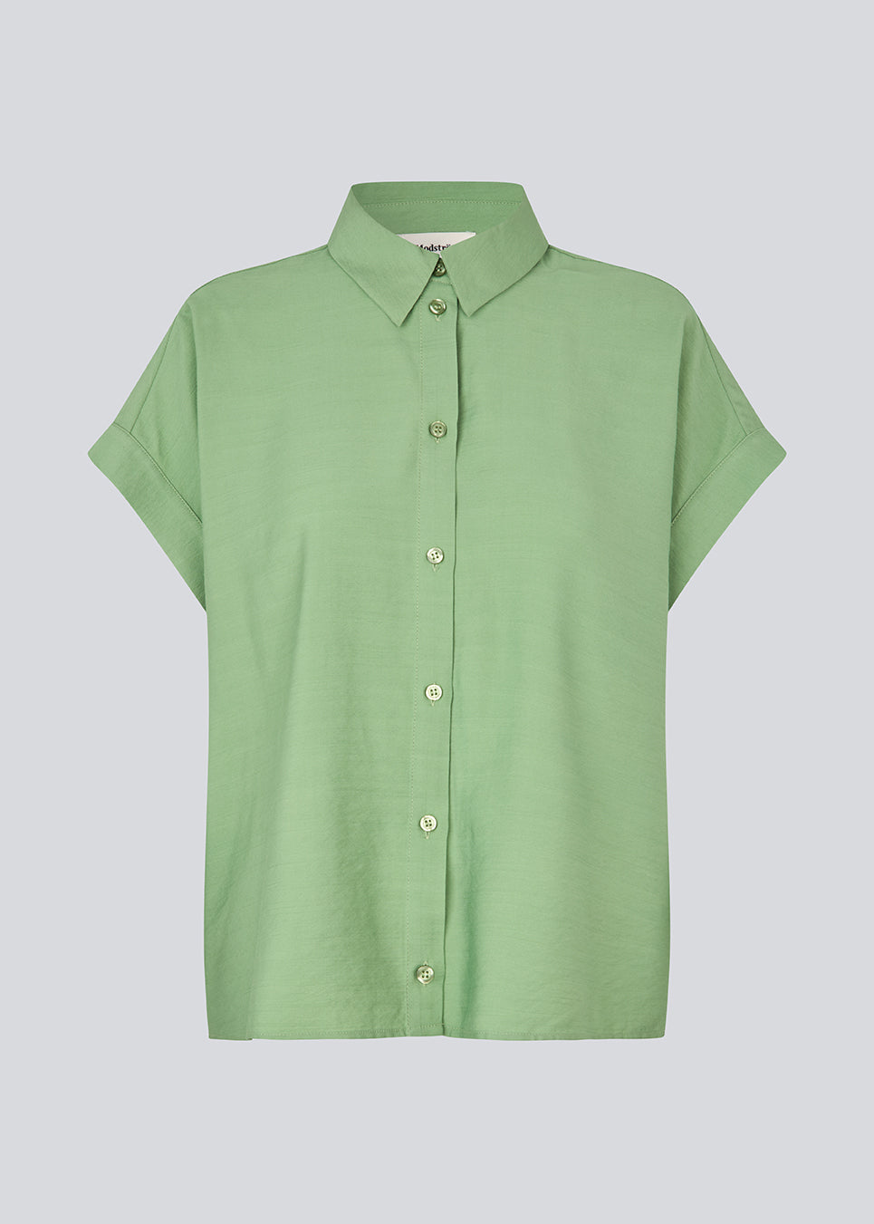 Short-sleeve shirt in a lightweight fabric. The AidaMD Shirt features classic details such as a collar and button closure. A timeless and elegant shirt, perfect for both everyday wear and more sophisticated looks.