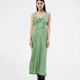 Long dress in lustrous satin with an open back. The AijaMD Dress features a feminine design with a beautifully draped skirt, a fitted waist, draping at the bust, and an elegant crisscross back. Made from 100% recycled polyester, it’s perfect for both evening and party looks.
