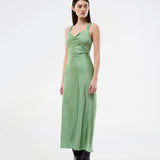 Long dress in lustrous satin with an open back. The AijaMD Dress features a feminine design with a beautifully draped skirt, a fitted waist, draping at the bust, and an elegant crisscross back. Made from 100% recycled polyester, it’s perfect for both evening and party looks.