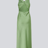 Long dress in lustrous satin with an open back. The AijaMD Dress features a feminine design with a beautifully draped skirt, a fitted waist, draping at the bust, and an elegant crisscross back. Made from 100% recycled polyester, it’s perfect for both evening and party looks.
