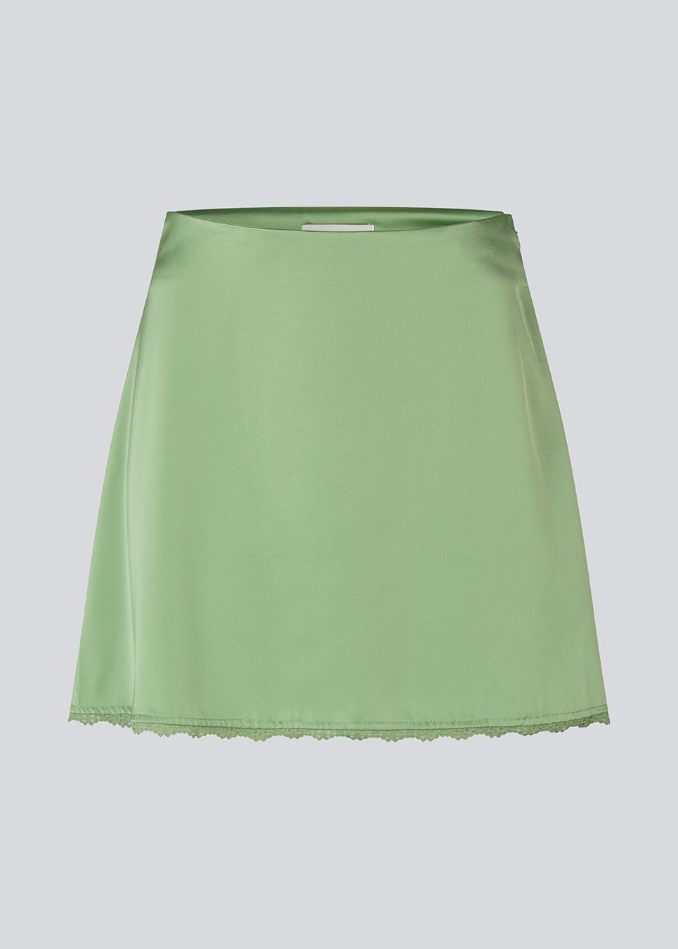 Mini skirt in lustrous satin. The AijaMD Skirt features feminine details such as a lace trim at the hem and a fitted cut that gently flares out at the bottom. The skirt has a discreet side zipper and is made from 100% recycled polyester.