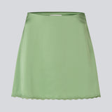 Mini skirt in lustrous satin. The AijaMD Skirt features feminine details such as a lace trim at the hem and a fitted cut that gently flares out at the bottom. The skirt has a discreet side zipper and is made from 100% recycled polyester.