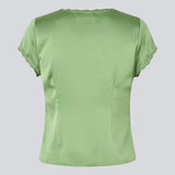 Feminine short-sleeve top in lustrous satin. The AijaMD Top features delicate details such as lace trims, a V-neckline, slight puff under the bust, and a bow detail. Made from 100% recycled polyester, perfect for both elegant and casual looks.