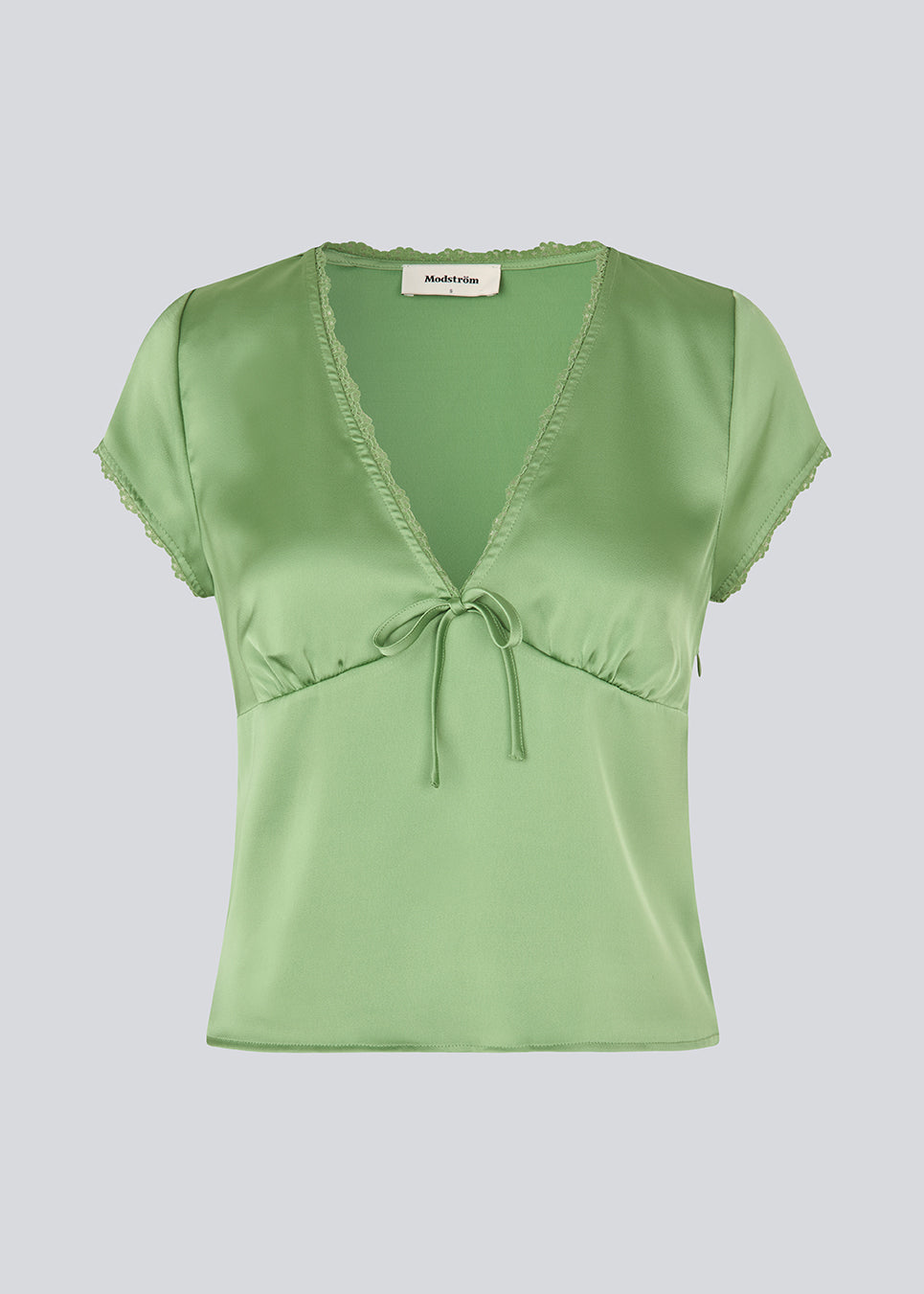 Feminine short-sleeve top in lustrous satin. The AijaMD Top features delicate details such as lace trims, a V-neckline, slight puff under the bust, and a bow detail. Made from 100% recycled polyester, perfect for both elegant and casual looks.