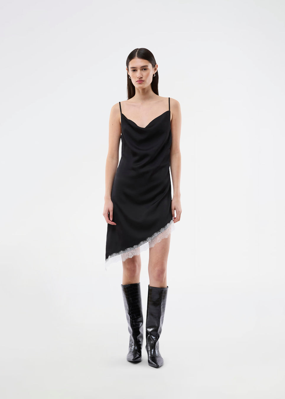 Short satin slip dress with contrast lace trim. The AlinkaMD Dress features spaghetti straps, a V-neckline, and an asymmetrical hem that is longer on one side. An elegant dress, perfect on its own or for layered styling.