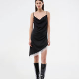 Short satin slip dress with contrast lace trim. The AlinkaMD Dress features spaghetti straps, a V-neckline, and an asymmetrical hem that is longer on one side. An elegant dress, perfect on its own or for layered styling.
