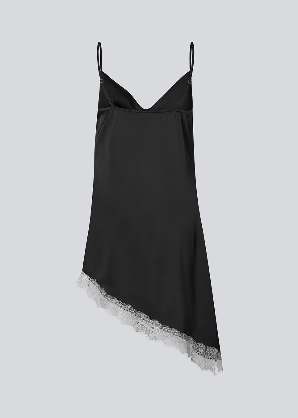 Short satin slip dress with contrast lace trim. The AlinkaMD Dress features spaghetti straps, a V-neckline, and an asymmetrical hem that is longer on one side. An elegant dress, perfect on its own or for layered styling.