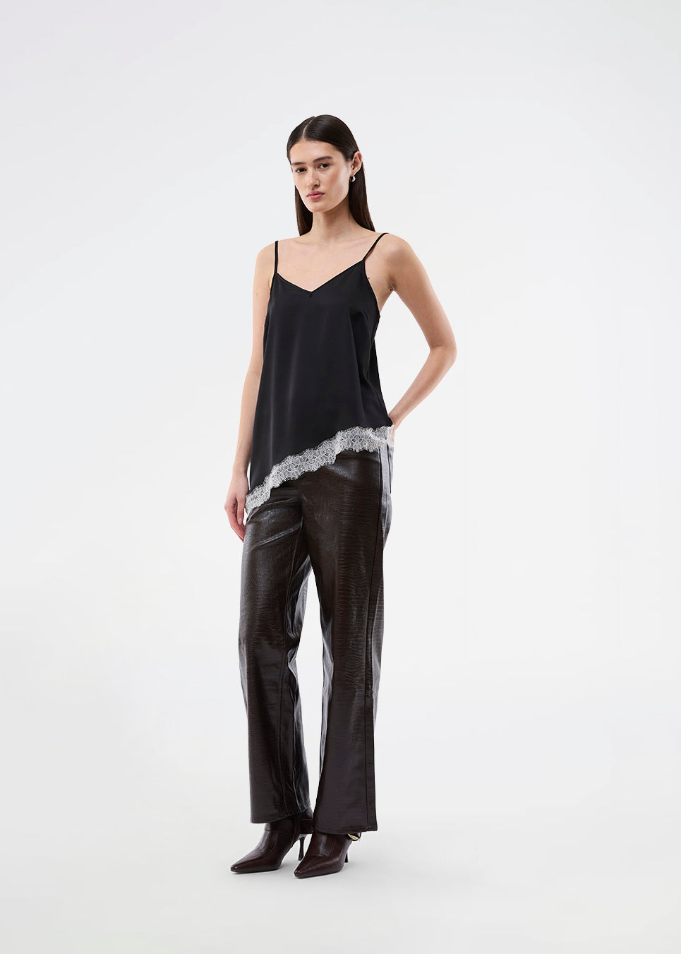 Satin slip top with contrast lace trim. The AlinkaMD Top features spaghetti straps, a V-neckline, and an asymmetrical hem that is longer on one side. An elegant top, perfect on its own or for layered styling.