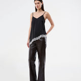 Satin slip top with contrast lace trim. The AlinkaMD Top features spaghetti straps, a V-neckline, and an asymmetrical hem that is longer on one side. An elegant top, perfect on its own or for layered styling.