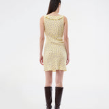 Feminine mini dress with a summery floral print. The AlyssaMD Print Dress is sleeveless and features a V-neckline with a ruffle trim and bow detail. The dress is fitted at the waist and has a beautifully flowing skirt, creating a feminine and elegant look.