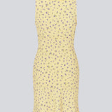 Feminine mini dress with a summery floral print. The AlyssaMD Print Dress is sleeveless and features a V-neckline with a ruffle trim and bow detail. The dress is fitted at the waist and has a beautifully flowing skirt, creating a feminine and elegant look.