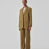 Oversized blazer with a drapy fit. AnkerMD blazer has collar and notch lapels with a single button closure. Flap welt front pockets. Slits on cuffs and single back vent. Lined.  The model is 177 cm and wears a size S/36. Style the blazer with matching pants in the same color: AnkerMD pants