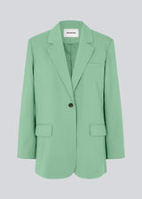 Oversized blazer in green with a drapey fit. AnkerMD blazer has collar and notch lapels with a single button closure. Flap welt front pockets. Slits on cuffs and single back vent. Lined.  The model is 177 cm and wears a size S/36. Style the blazer with matching pants: AnkerMD pants, or shorts: AnkerMD shorts, in the same color.