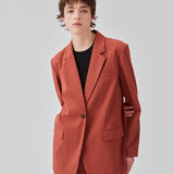 Oversized blazer in the color maple with a drapy fit. AnkerMD blazer has collar and notch lapels with a single button closure. Flap welt front pockets. Slits on cuffs and single back vent. Lined. 