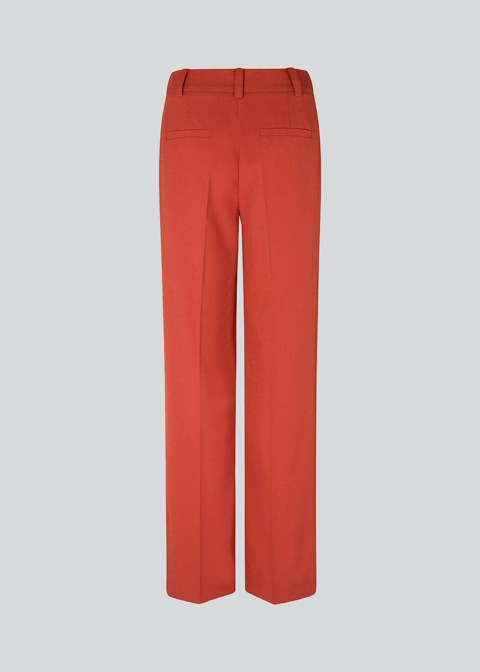 Pants in red with wide legs and a medium waist. AnkerMD pants have creases, button and zip fly, side pockets and paspel back pockets.  The model is 177 cm and wears a size S/36. Style the pants with a matching blazer in the same color: Gale blazer.