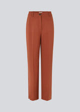 Pants in the color Maple with wide legs and a medium waist. AnkerMD pants have creases, button and zip fly, side pockets and paspel back pockets. 