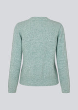 Fine knit jumper in light blue in a more responsible quality. AnnaMD o-neck has a slim silhouette with long sleeves and round neck. Ribknitted trimmings.  The model is 177 cm and wears a size S/36.