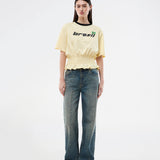 T-shirt with Brazil logo and scrunch detailing at the waist. The AnsgarMD T-Shirt features contrast trim on the round neckline, short sleeves, and a ruffled hem. A feminine and modern T-shirt, perfect for relaxed yet stylish everyday looks.