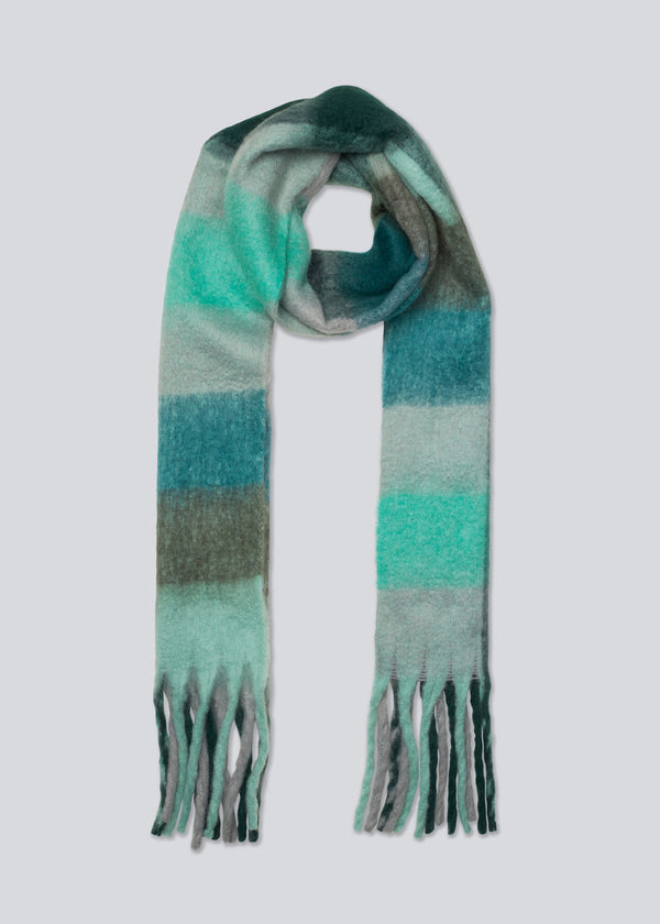 Oversized and snug scarf with brushed finish in a colourful mix with fringes along the shorter sides.