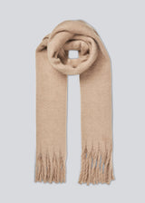 Oversized and snug scarf in a beige color with brushed finish with fringes along the shorter sides.