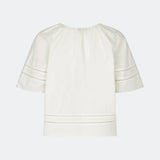 Short-sleeve blouse with embroidery details. The AyoMD Top has a relaxed fit with gathered details at the neckline and a V-neckline with a single button. Made from a lightweight 100% organic cotton fabric, perfect for a feminine and relaxed look.
