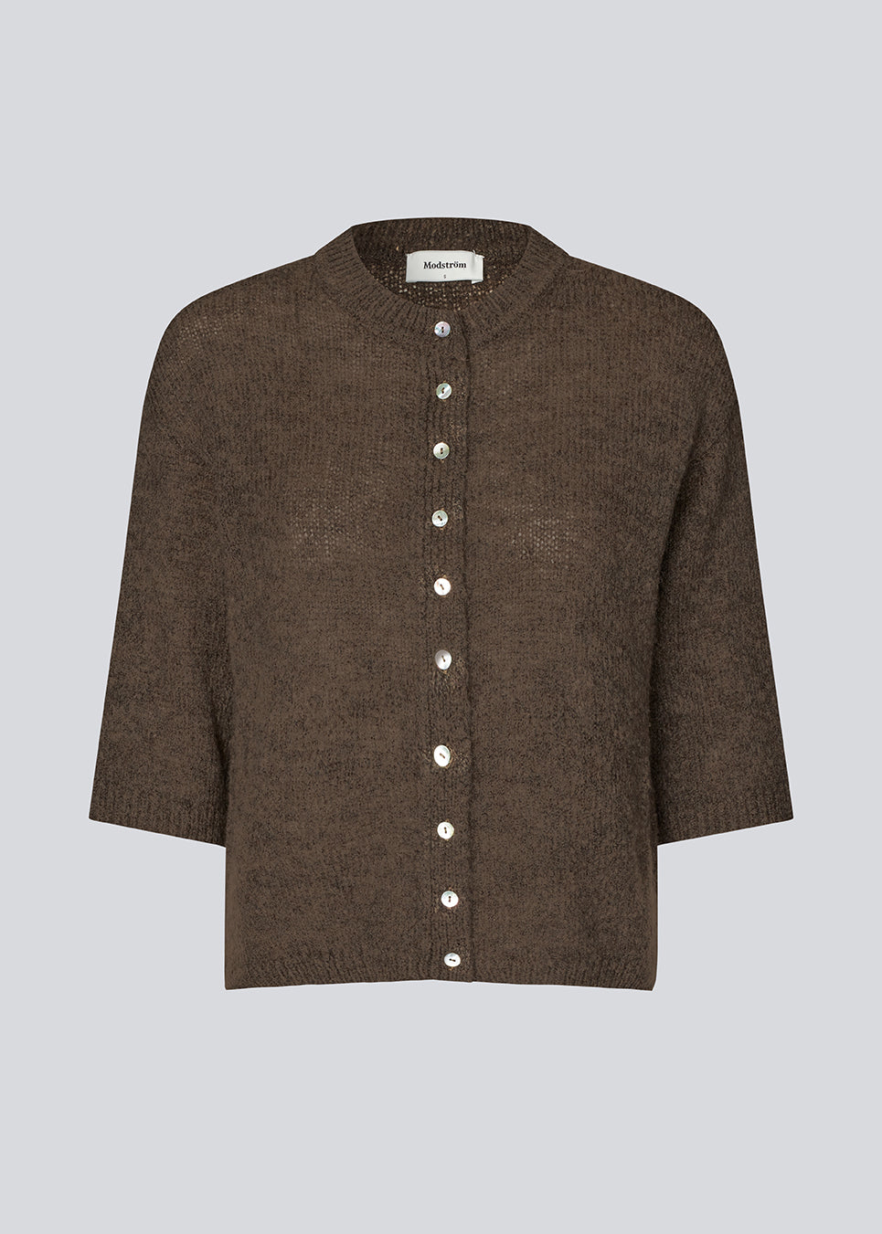 3/4-sleeve cardigan in lightweight, soft knit. The BailorMD Cardigan features ribbed trims, a button closure, and a relaxed fit – perfect worn alone or as a trendy layering piece.