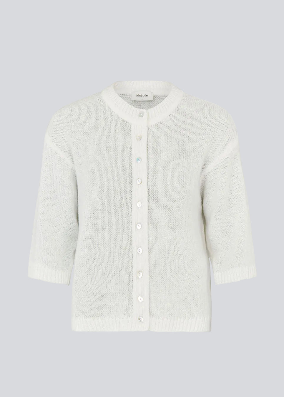 3/4-sleeve cardigan in lightweight, soft knit. The BailorMD Cardigan features ribbed trims, a button closure, and a relaxed fit – perfect worn alone or as a trendy layering piece.