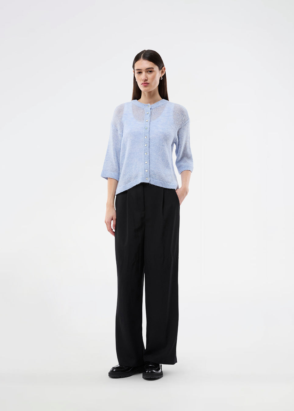 3/4-sleeve cardigan in lightweight, soft knit. The BailorMD Cardigan features ribbed trims, a button closure, and a relaxed fit – perfect worn alone or as a trendy layering piece.