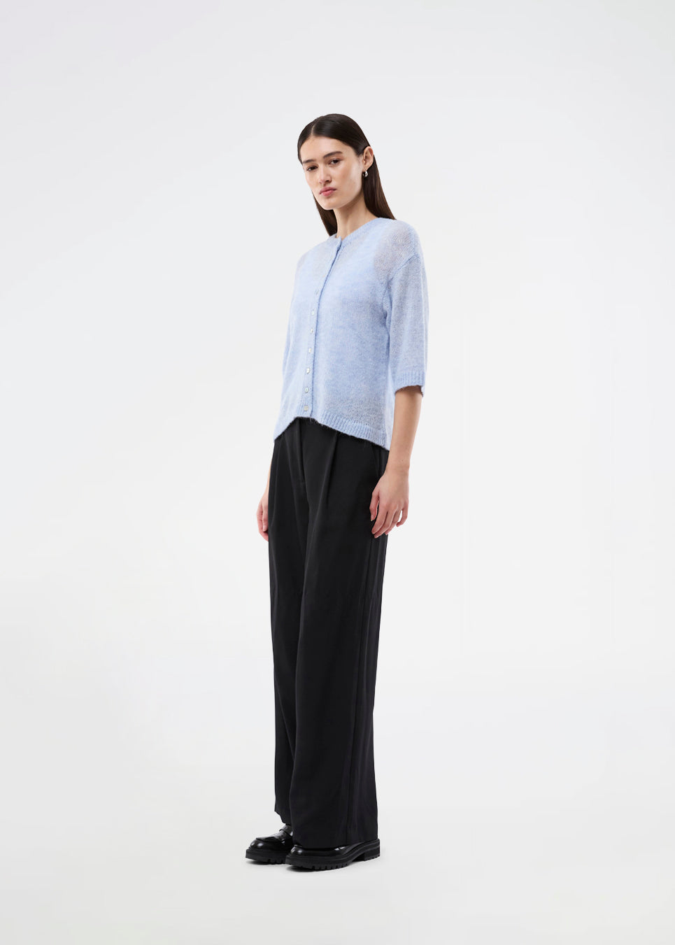 3/4-sleeve cardigan in lightweight, soft knit. The BailorMD Cardigan features ribbed trims, a button closure, and a relaxed fit – perfect worn alone or as a trendy layering piece.
