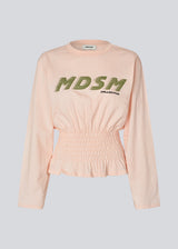 Long-sleeve T-shirt with smocked waist detail. The BariMD LS T-Shirt features a logo on the front, a round neckline, and combines a sporty look with feminine, flattering details -&nbsp;a trendy and effortless everyday favorite.