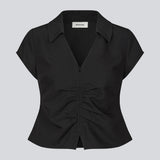 Feminine, tailored top. The BeamMD Top features a shirt collar, short sleeves, a V-neckline, and a front zip closure with gathered detailing - a flattering and trendy style, perfect for taking you from day to night.