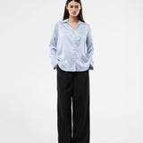 Elegant shirt in a shiny jacquard print. The BeaMD Shirt features a collar, V-neckline, button closure, cuffed sleeves, and shorter side seams - a versatile and exclusive statement top with a modern, sophisticated look.