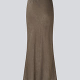 Long elegant skirt in luxurious textured satin. The BelineMD Skirt is fitted at the waist, features a subtle A-line silhouette, and a stylish belt-tie detail - a chic and versatile piece made from 100% recycled polyester.