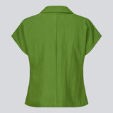 Short-sleeved blazer vest with a notched collar. The BenittaMD Vest features a relaxed, waist-focused fit, side pockets, and a single-button closure – the lightweight fabric creates a modern, effortless look, perfect worn alone or layered for a sharp, fashion-forward style.
 