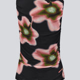 Elegant, fitted top in lightweight, sheer mesh with front ruching that accentuates the silhouette. The BenjaMD Print Top features a graphic floral print on a black base, creating a modern, eye-catching, and sleek look - perfect for both day and evening, worn alone or layered under a blazer for a cool style.