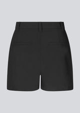 Discover elegance and comfort with our BennyMD High-Waisted Shorts. These black shorts feature a tight fit with discreet side pockets and decorative paspoil pockets on the back. BennyMD shorts come with a zip fly and button closure, along with belt loops for added style.