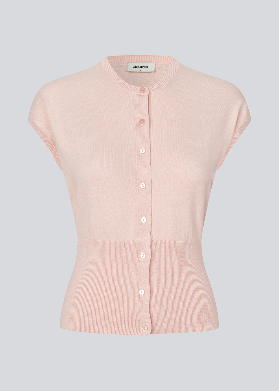 Feminine sleeveless cardigan in lightweight, luxurious knit. The Bernadette MD Vest features elegant ribbed trims, a stylish button closure, and a round neckline, with a tailored fit and an extra-wide ribbed waistband. Made from soft, 100% organic cotton – a timeless wardrobe must-have.