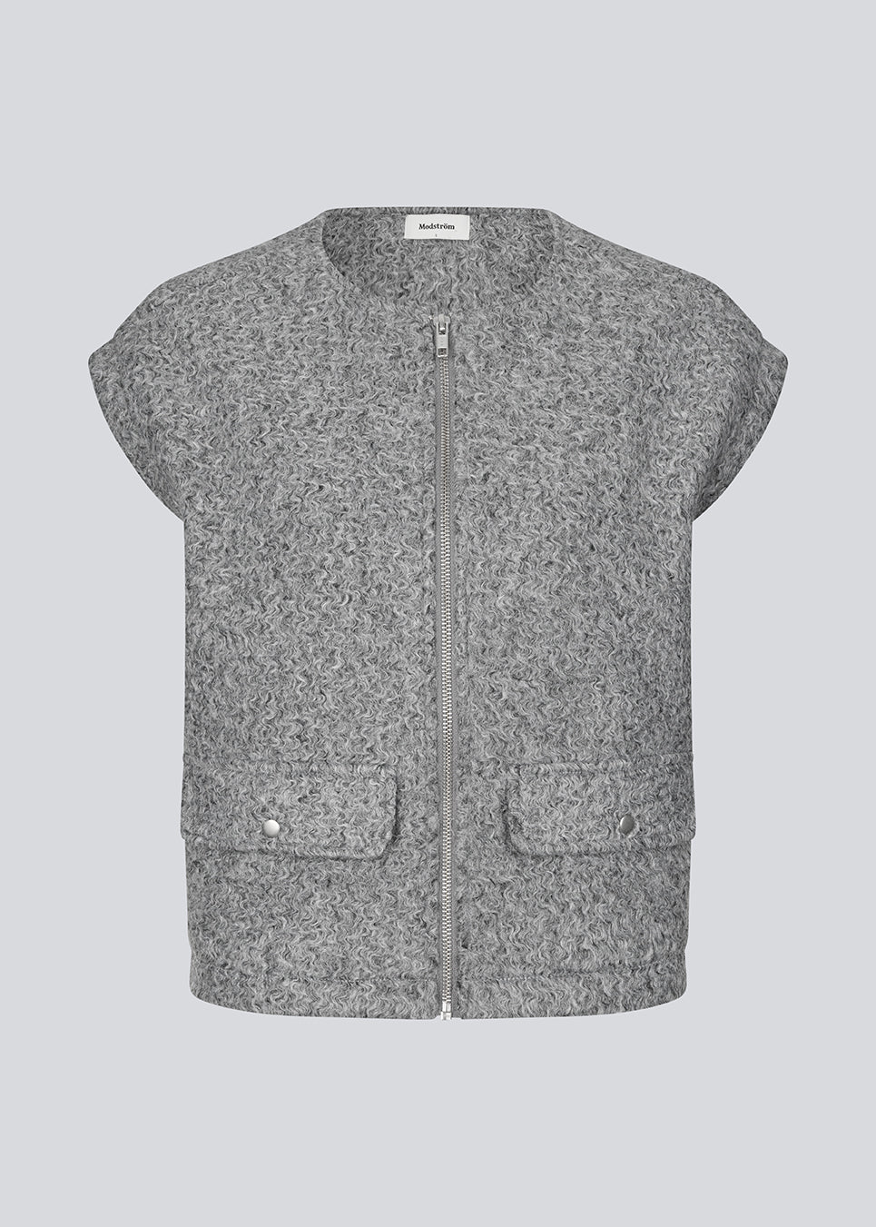 Trendy vest in a wool-look. The BibberMD Vest features a front zip closure, round neckline, and side pockets with flaps and snap buttons – a sleek and chic layering piece that adds a modern, polished touch to the wardrobe.