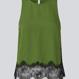 Edgy top with lace detailing. The BirkMD Top features a high, round neckline, is sleeveless, and has a relaxed fit - the contrasting lace adds a cool and feminine touch, made from 100% recycled polyester.