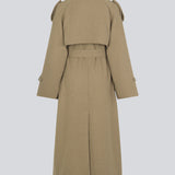 Coat in Dune in trenchcoat style with an oversized silhouette. BorakMD coat is double-breasted with a collar, open yoke, belt at the waist, and a slit in the back. Woolen quality. Lined.